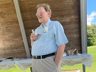 Faculty at graduation celebration outdoors