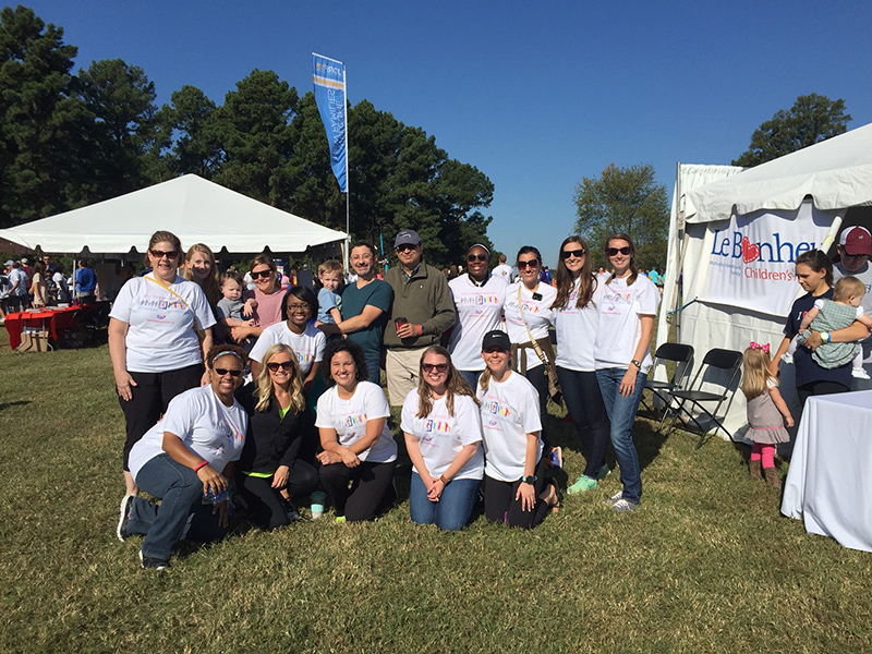 Group photo of fellows at an outdoor fair