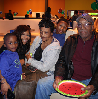Program Coordinator and family at bowling alley