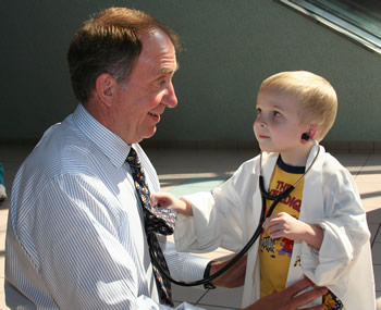 doctor and small child with a stethoscope