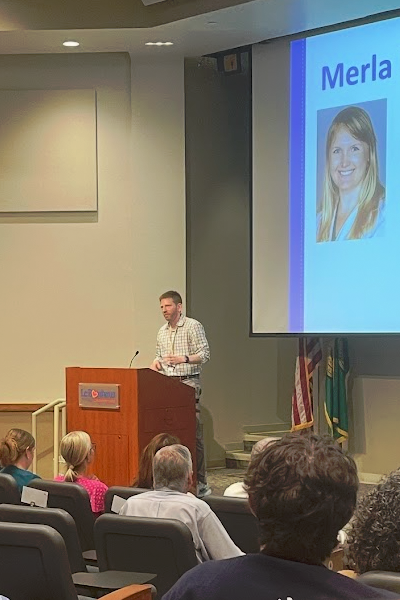 Faculty speaking at a podium