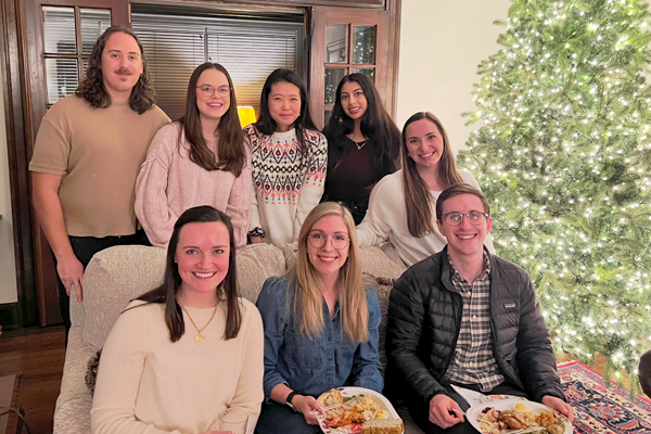 Eight residents eating dinner in a holiday setting
