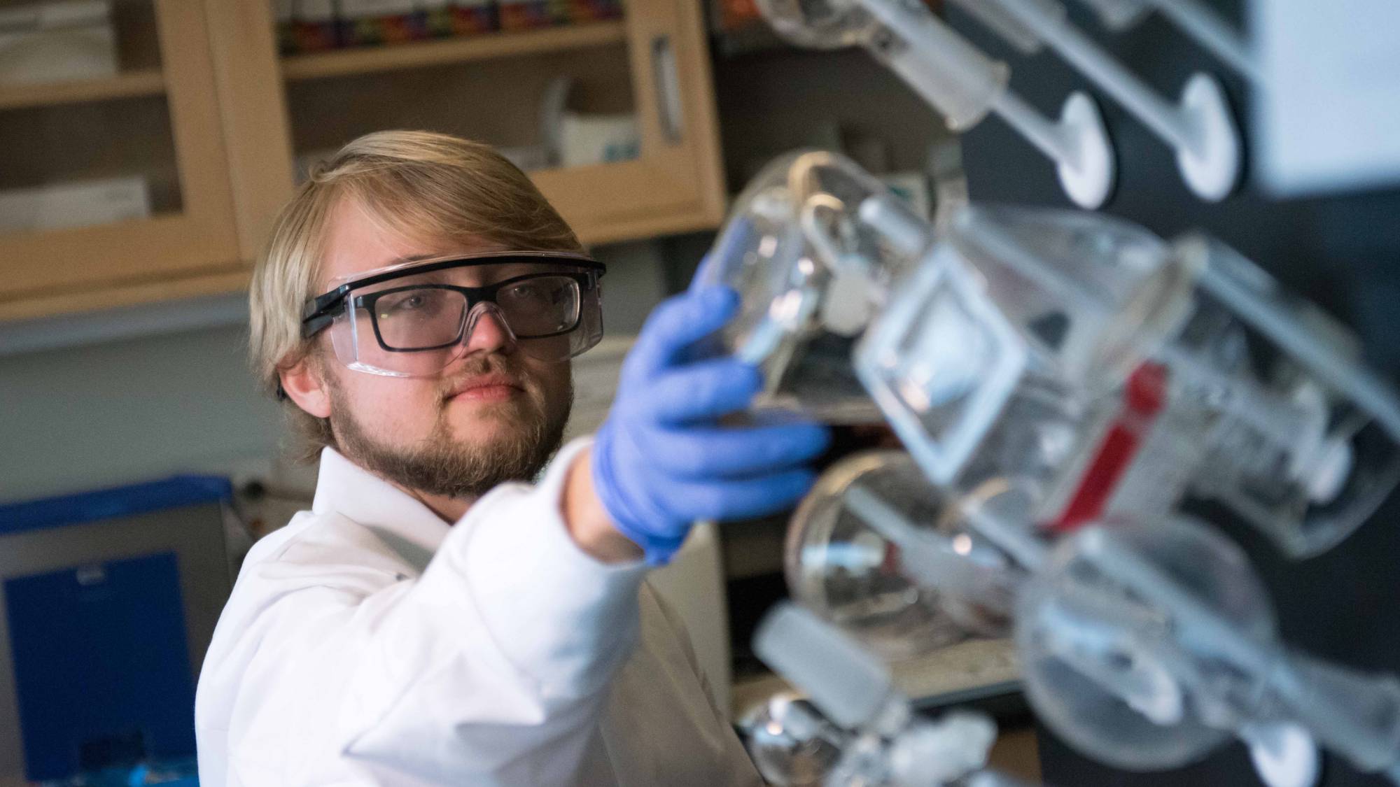 Student researcher working in a research lab.