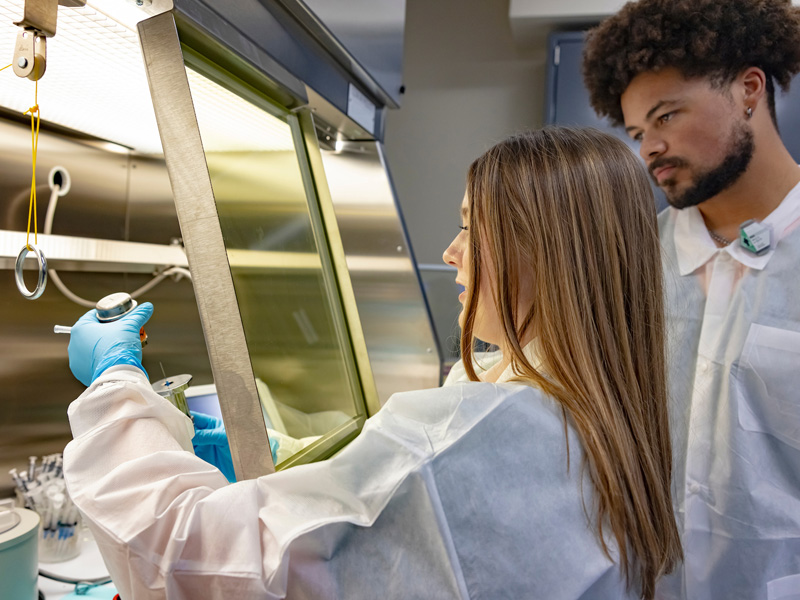 Pharmacy students in a nuclear pharmacy lab setting.