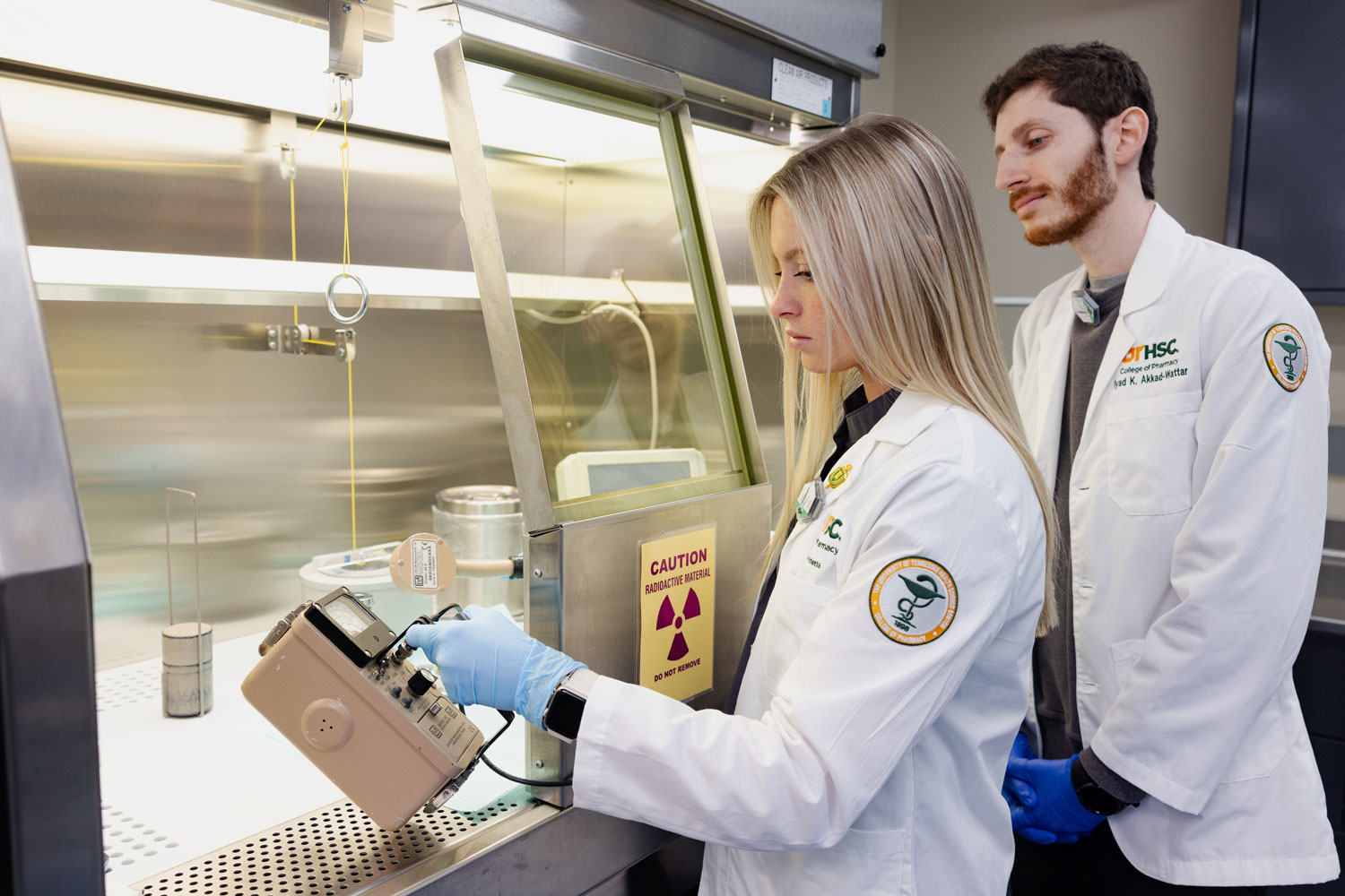 Students work with nuclear pharmacy materials.