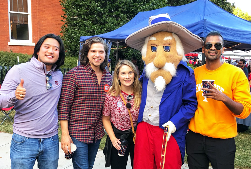 Four residents with a mascot