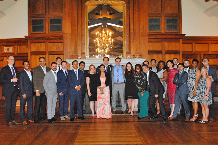 Fellows, faculty, and families at graduation