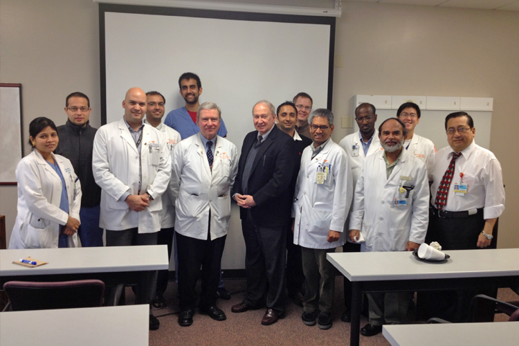 Faculty, fellows and visiting lecturers in a classroom 