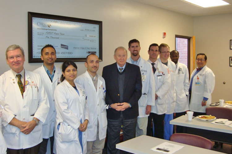 Faculty, fellows and visiting lecturers in a classroom 