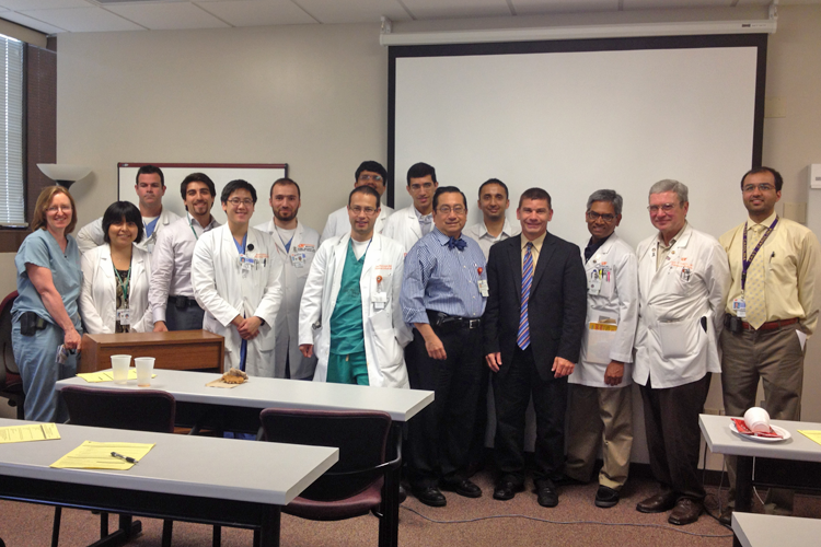 Faculty, fellows and visiting lecturers in a classroom 