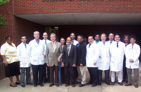 Faculty and fellows outside the Coleman Building