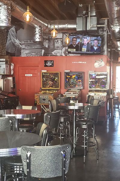 Empty tables at the pinball venue