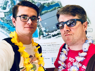 Two male residents with leis around their necks