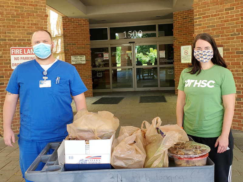 sally badoud donating food to health care hero